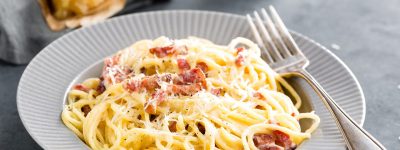 Carbonara pasta, spaghetti with pancetta, egg, hard parmesan cheese and cream sauce. Traditional italian cuisine. Pasta alla carbonara